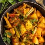 pinterest image with the title green beans, potatoes and tomatoes.