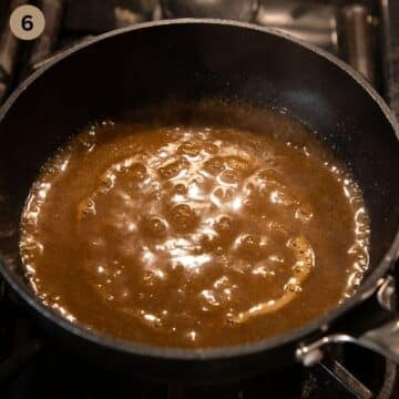 bubbling thick gravy for roast in a small saucepan.