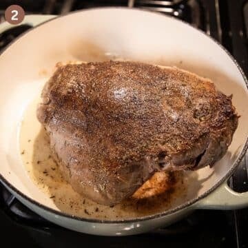 searing a venison roast in a dutch oven.