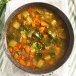 freekeh soup with lots of vegetables in a bowl.