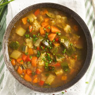 freekeh soup with lots of vegetables in a bowl.