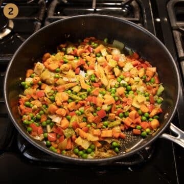 cook vegetables for making a casserole in a saucepan.