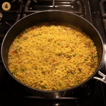 cooked millet in a saucepan.