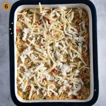 millet with vegetables, sprinkled with cheese in a baking dish before cooking.