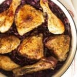 chicken and red cabbage simmered in a dutch oven.