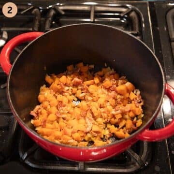 sauteing carrots, bacon and onion in a dutch oven to make soup.