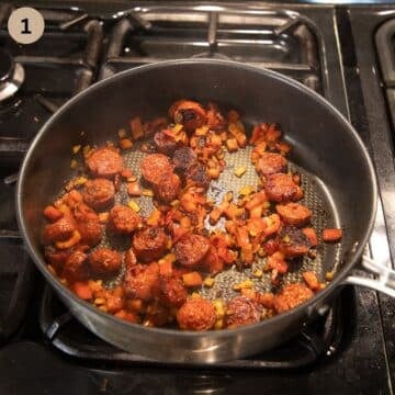 sauteing onions, carrots and garlic in a pan to make stew.