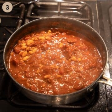 simmering chorizo and bean stew in a saucepan.