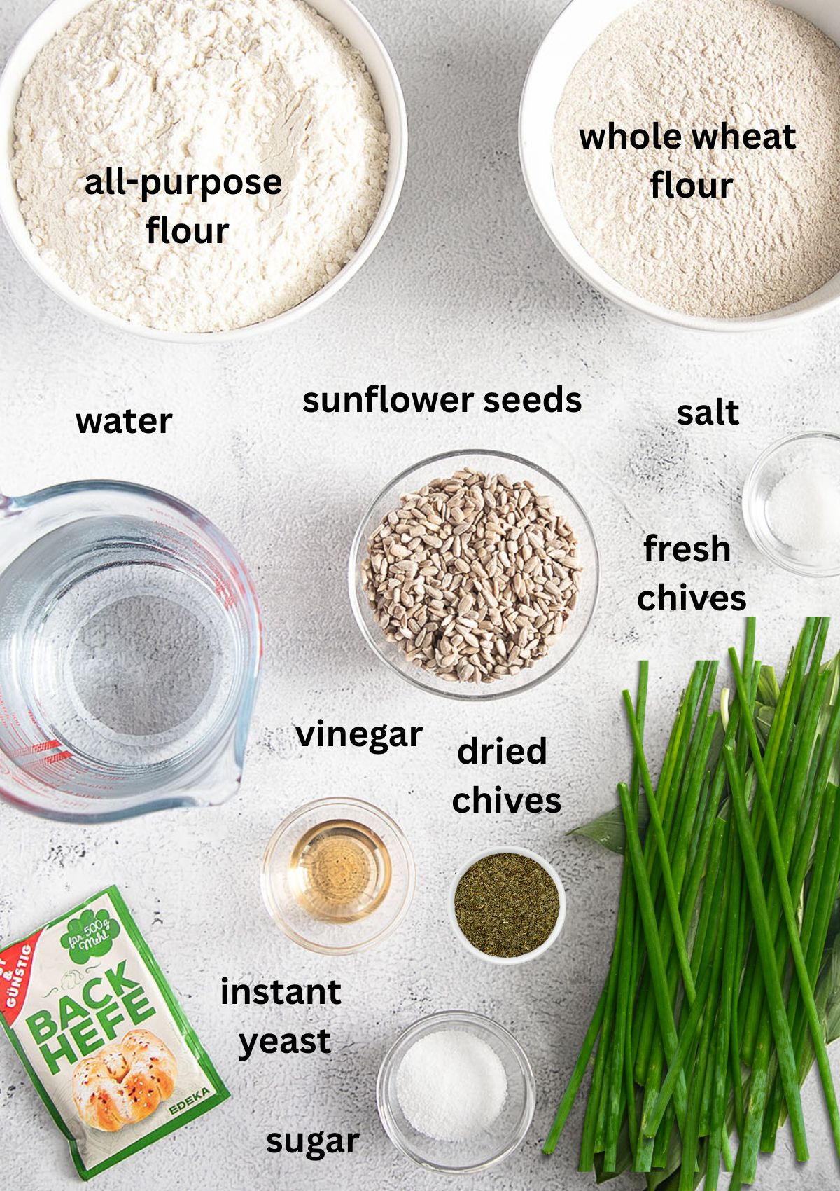 labeled ingredients for making bread with chives and sunflower seeds.