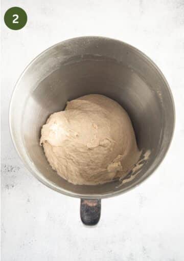 bread dough in a the bowl of a stand mixer.