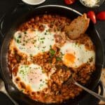 pinterest image with the title baked beans with eggs.
