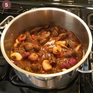lamb stifado in a pot before cooking it.