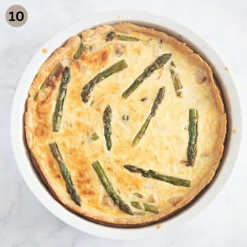 baked asparagus quiche with salmon and cheese in a baking dish.