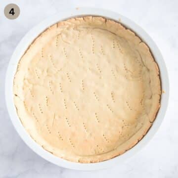 pre-baked pie crust in a baking dish.