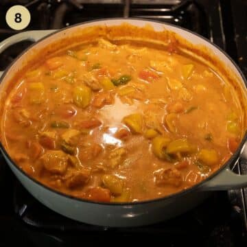 chicken goulash in a pot after stirring in sour cream.