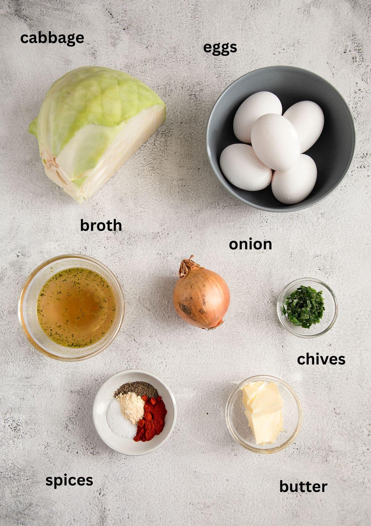 labeled ingredients for making eggs with cabbage, onions, and spices.