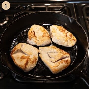four chicken breasts cooking in a skillet.