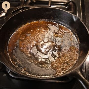 sauce reducing in a pan.