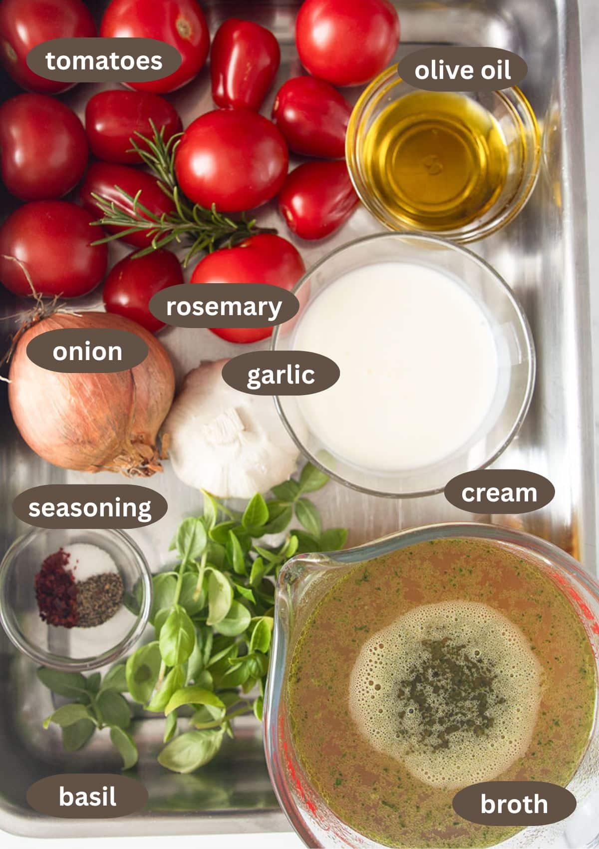 labeled ingredients for making soup with tomatoes, garlic, and basil.