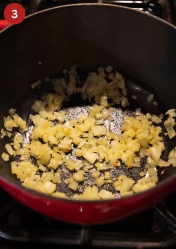 sauteing onions in a pot for making soup.