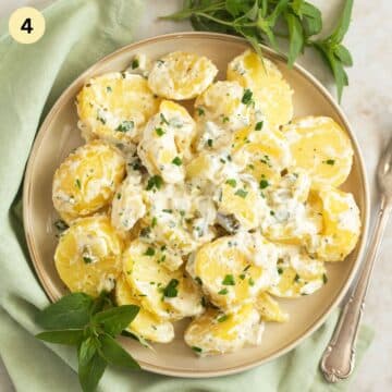 potatoes with sour cream and pickles on a plate.