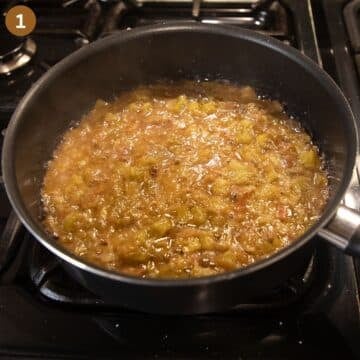 simmering rhubarb and sugar in a saucepan.