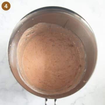 blended rhubarb and strawberries mixed with yogurt to make ice cream.