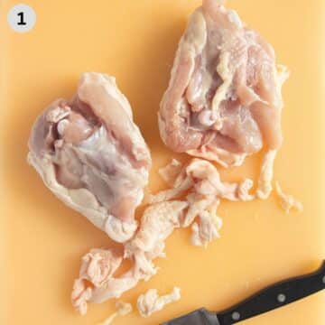 trimming excess fat from the underside of chicken thighs with a small knife.