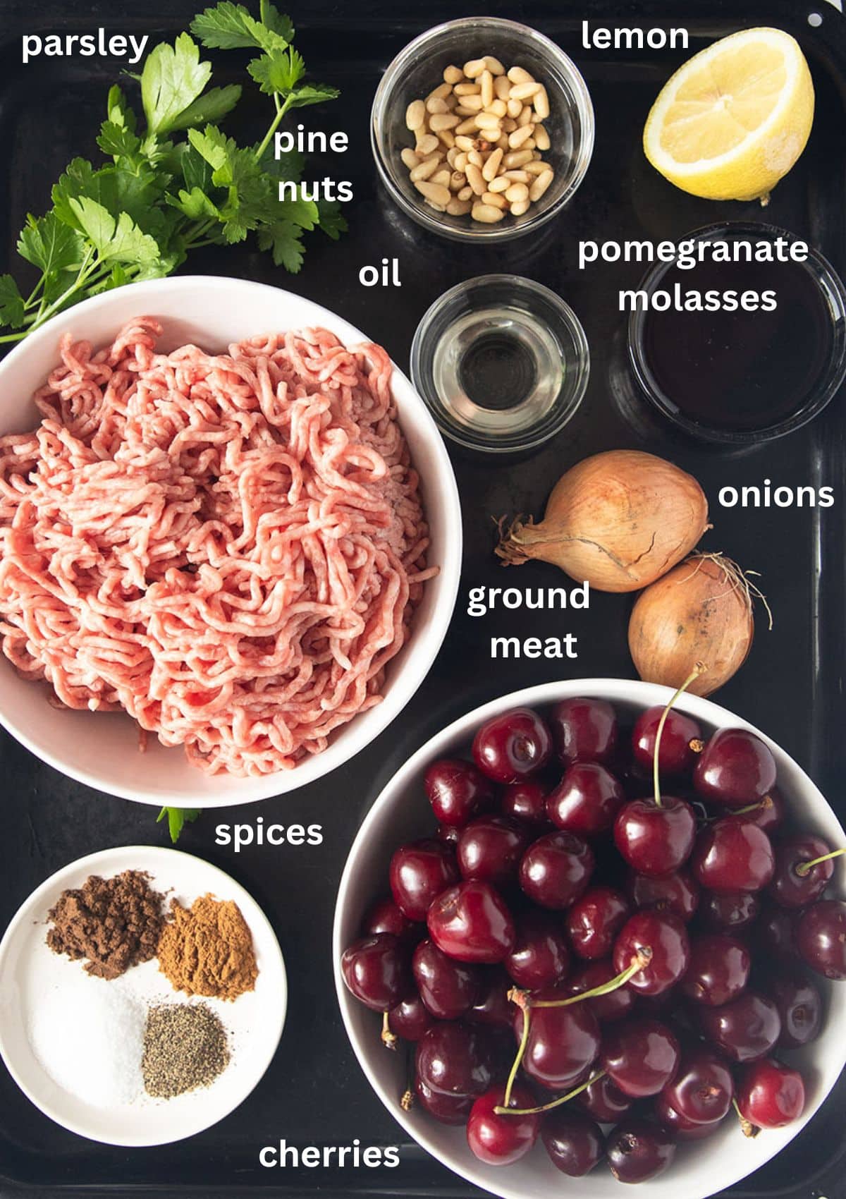 labeled ingredients for making meatballs with cherry sauce.