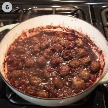 simmering meatballs in cherry sauce.