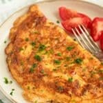 pin image with the title fluffy chili omelet.