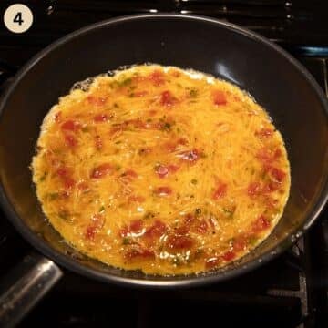 cooking omelet in a skillet.