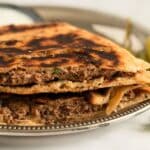 two lamb arayes on a plate.