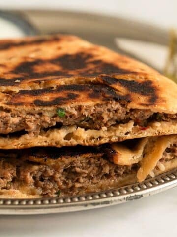 two lamb arayes on a plate.