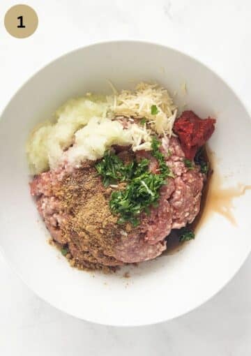 ingredients for making the filling for lamb arayes in a bowl.