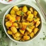 lebanese potatoes with fresh chili sauce in a bowl.