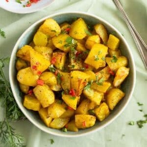 lebanese potatoes with fresh chili sauce in a bowl.