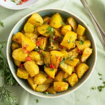 lebanese potatoes with fresh chili sauce in a bowl.