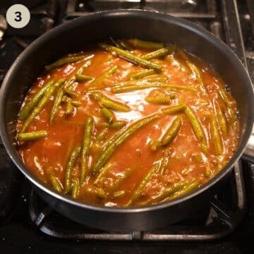 simmering green bean stew in a large saucepan.