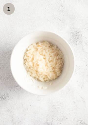 half-cooked rice in a small bowl.