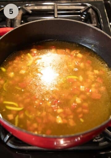 simmering vegetables in broth to make soup.