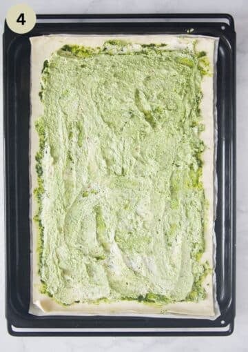 puff pastry laid out on a baking sheet, spread with a creamy mascarpone mixture.