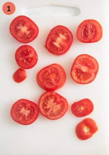 tomato slices on a white cutting board.