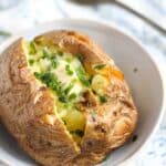 pin image with the title bakek potatoes with butter and chives.