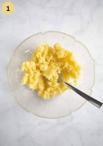 mixing riced potatoes with oil for making dumpling dough.