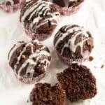 pin image with the title cocoa pumpkin muffins.