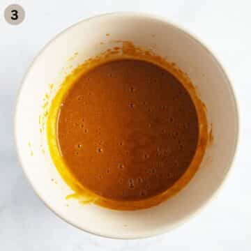 mixed pumpkin puree and sugar in a bowl to make muffins.
