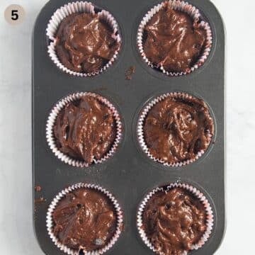 unbaked muffin batter in a muffin tin.