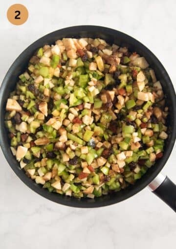 chopped ingreidents for making mincemeat with green tomatoes in a pot.