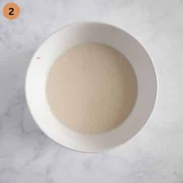 flour and water mixture needed to thicken ground beef sauce in a small bowl.